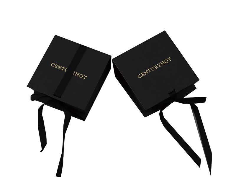 Black book-shaped box with silk ribbon for jewelry storage