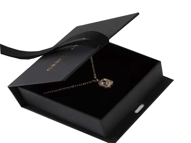 Book-shaped magnetic necklace box with ribbon closure