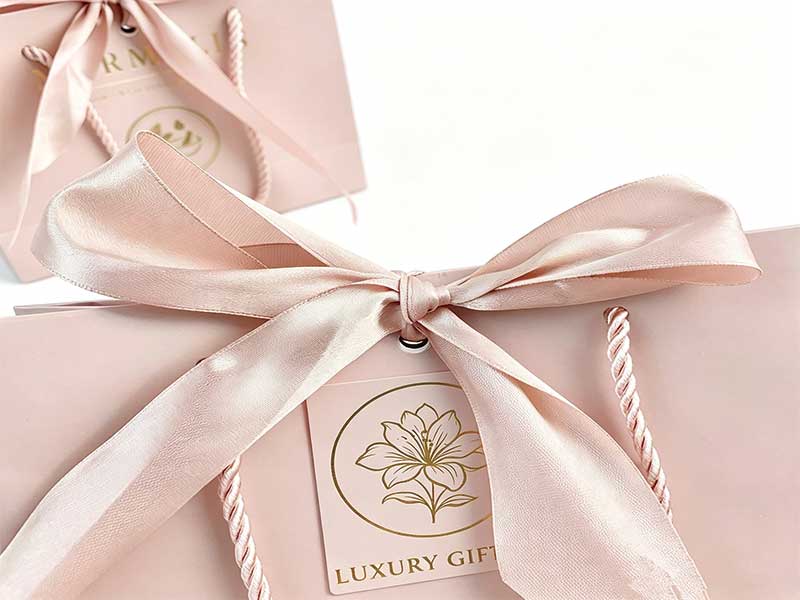Custom paper bags with bow – art paper gift bags with elegant silk ribbon