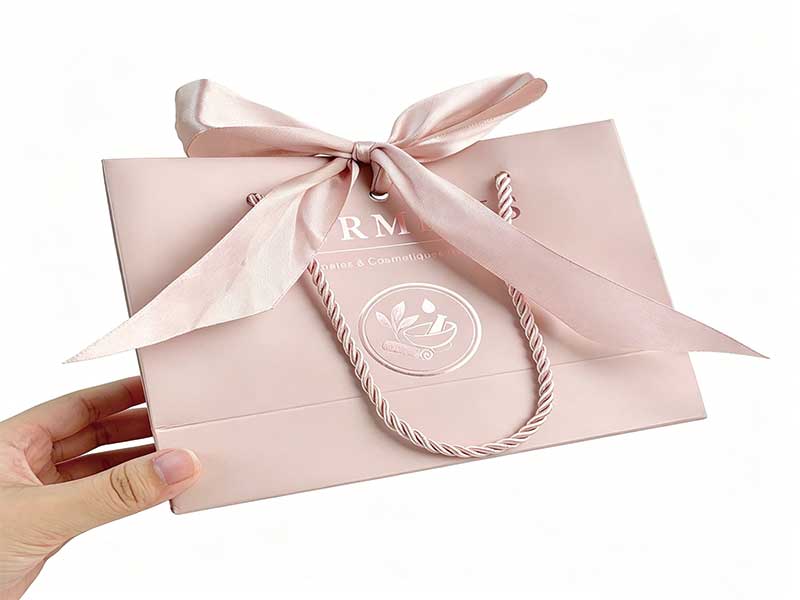 Custom luxury paper bags with bow – coated paper bags with ribbon handle and bow