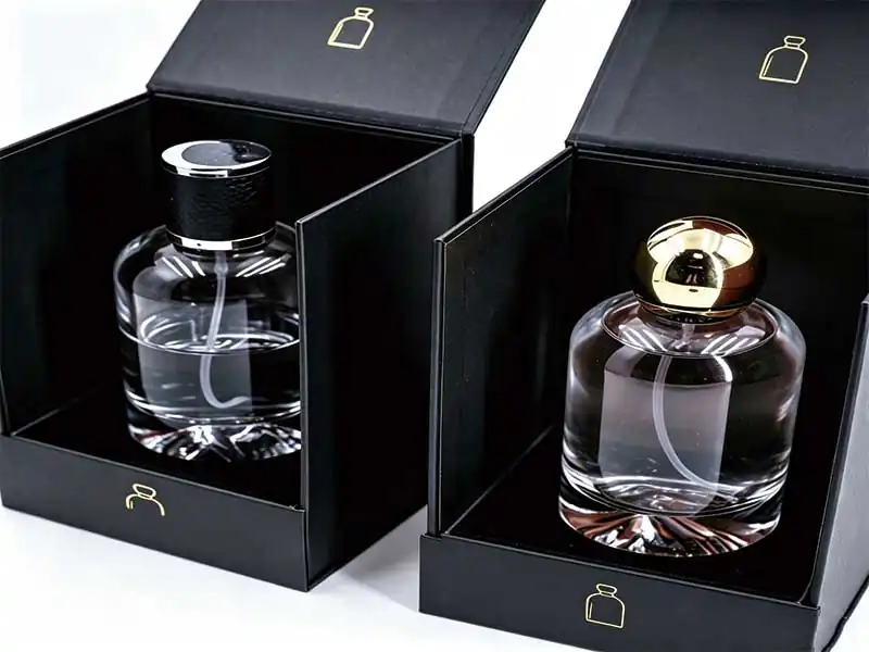 Black paper box with gold foil logo for luxury perfume packaging